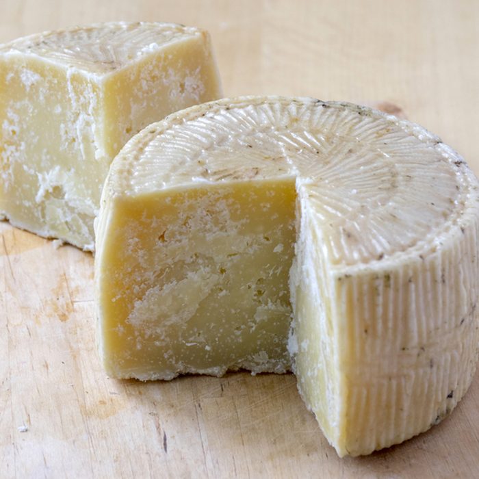 Pecorino cheese on wooden table