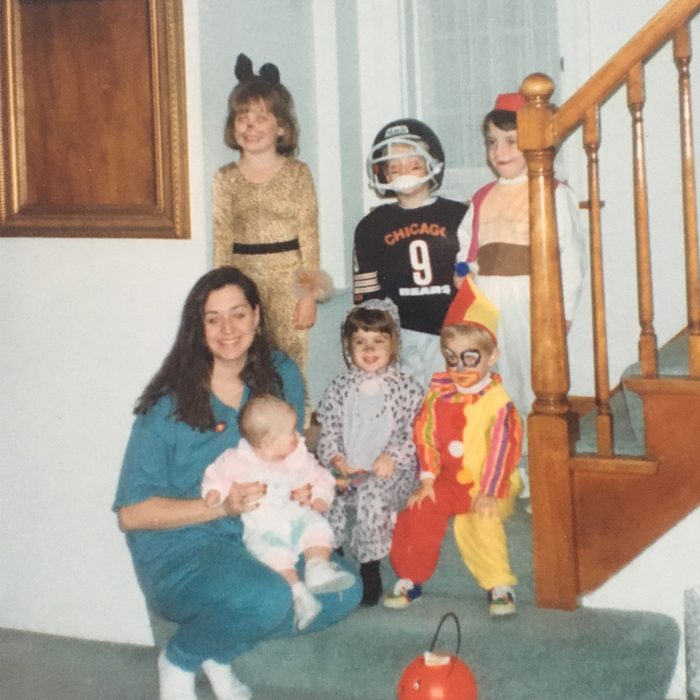 five children and adult in Halloween costumes