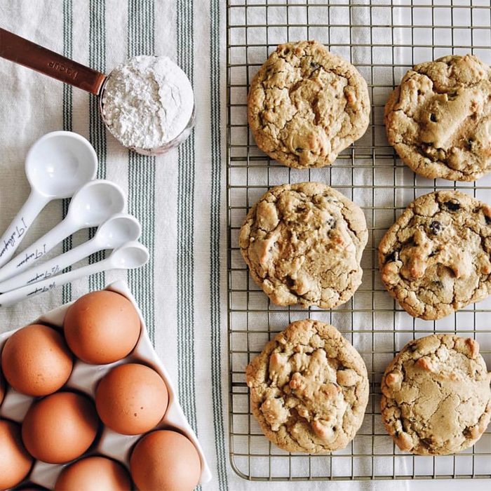 fresh baked cookies with eggs and measuring spoons