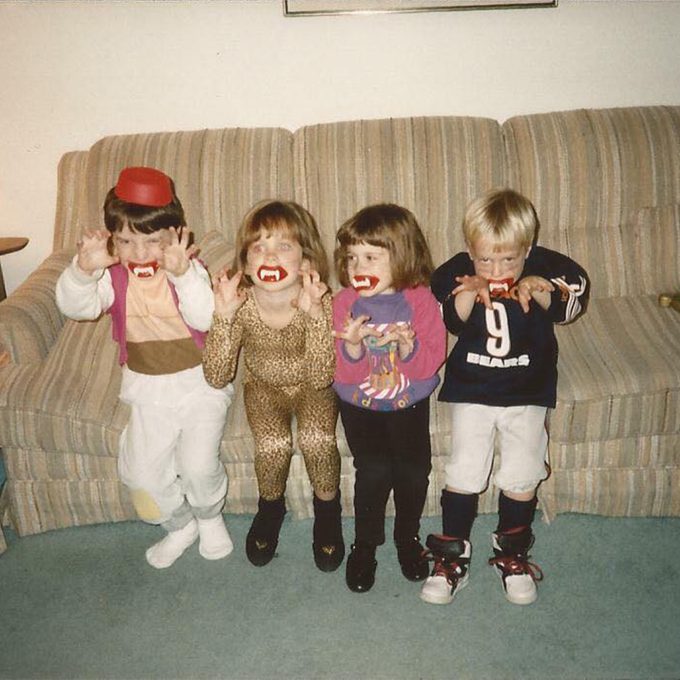 four children dressed in Halloween costumes