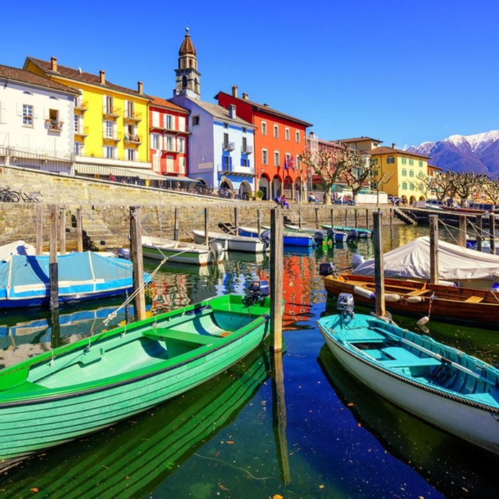 Colorful boats in old town of Ascona on Lago Maggiore lake in the Alps mountain, Ticino, Switzerland