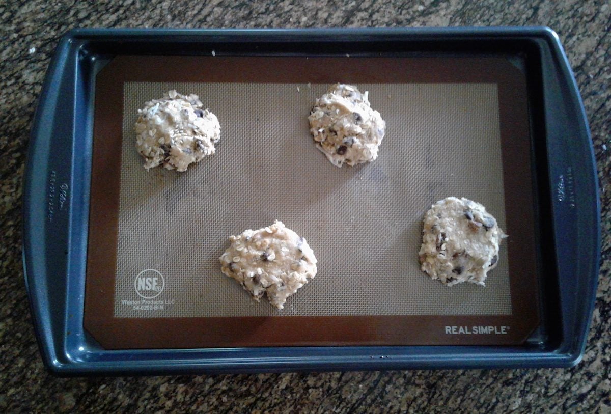 Cowboy Cookies dough on a cookie sheet