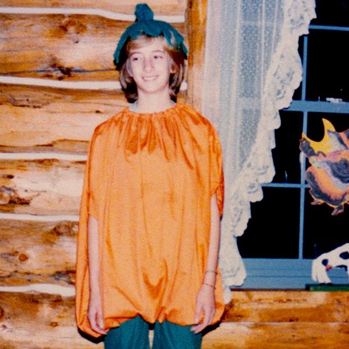 girl dressed as a pumpkin for Halloween