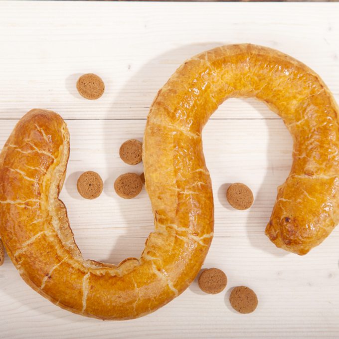 Traditional Dutch cookie Banketletter at Sinterklaas celebration on wooden background