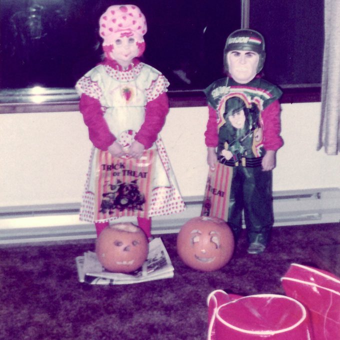two children in Halloween costumes
