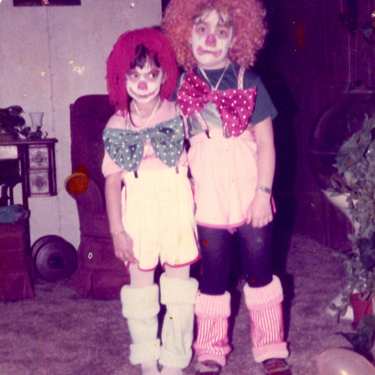 two children dressed as a clown and a raggedy anne for Halloween