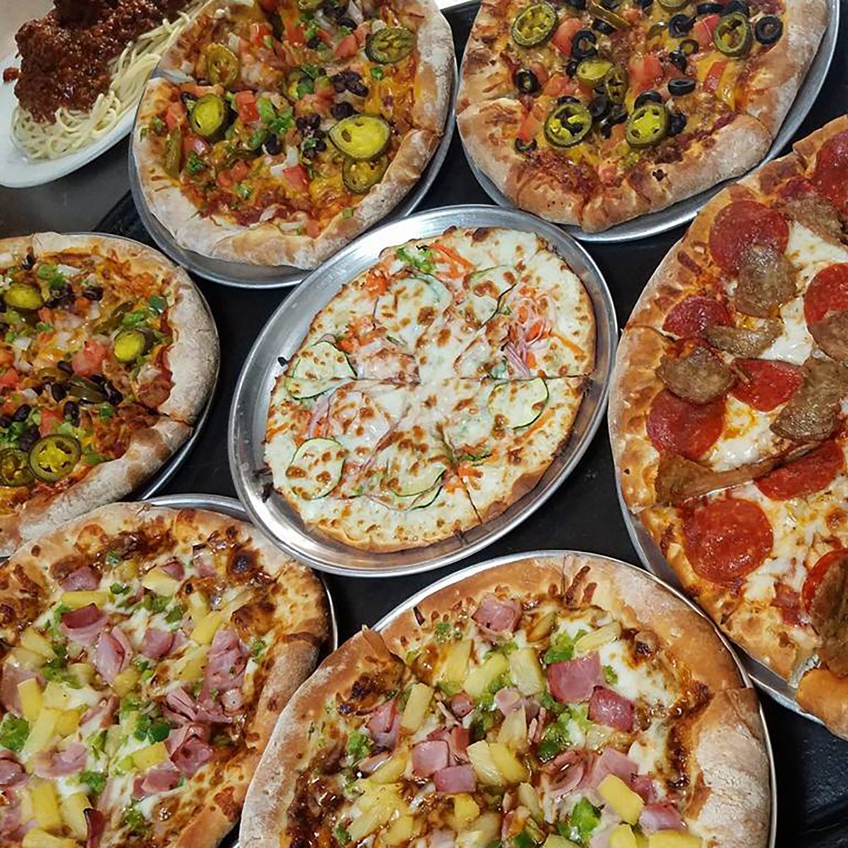 a large selection of pizzas with different toppings from Joe Bologna's Restaurant