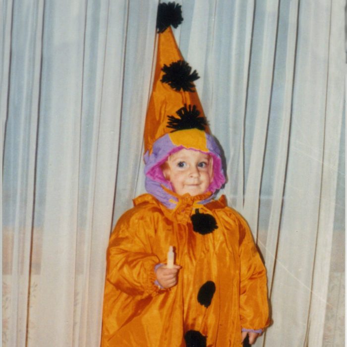 child dressed in Halloween costume