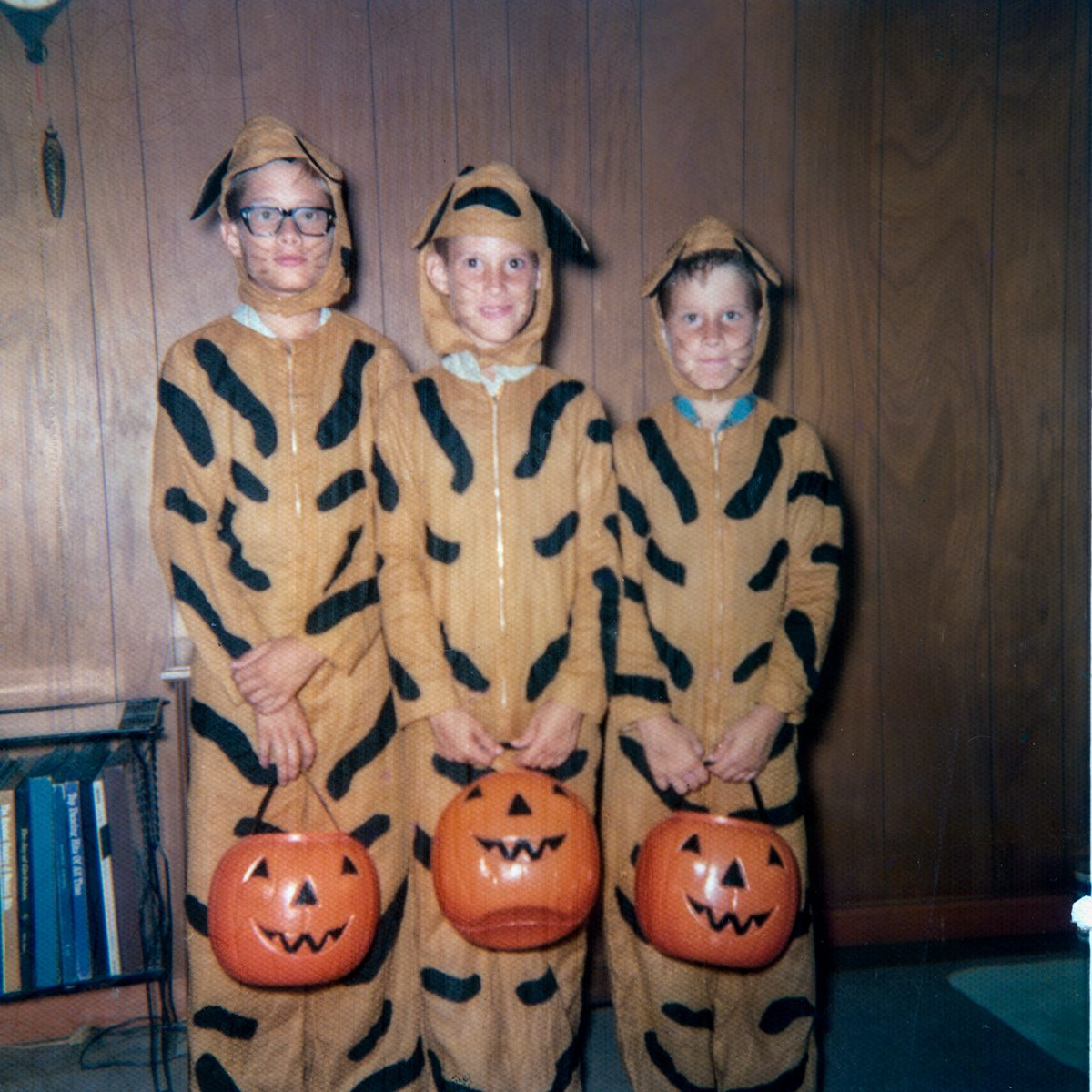 three children dressed as tiger for Halloween