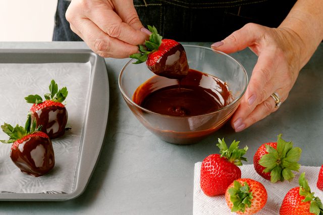 dipping strawberries in melted chocolate