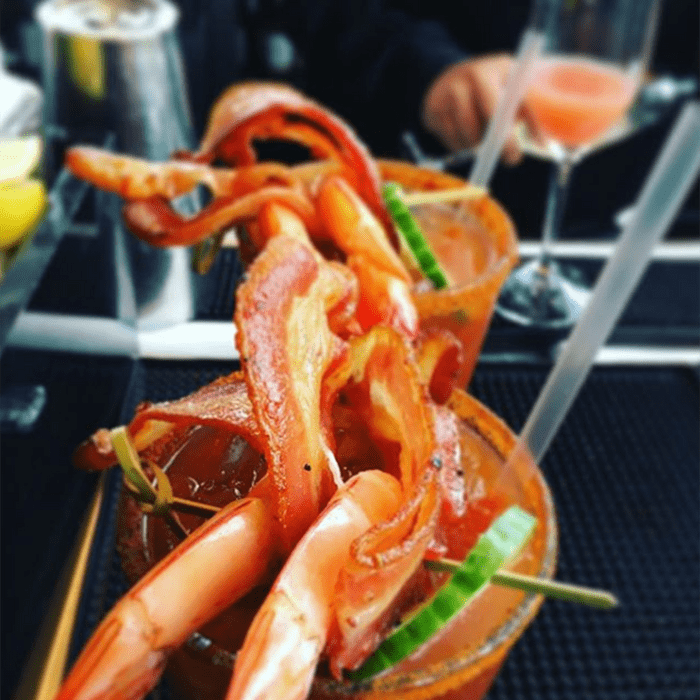 Bloody Mary topped with shrimp and bacon