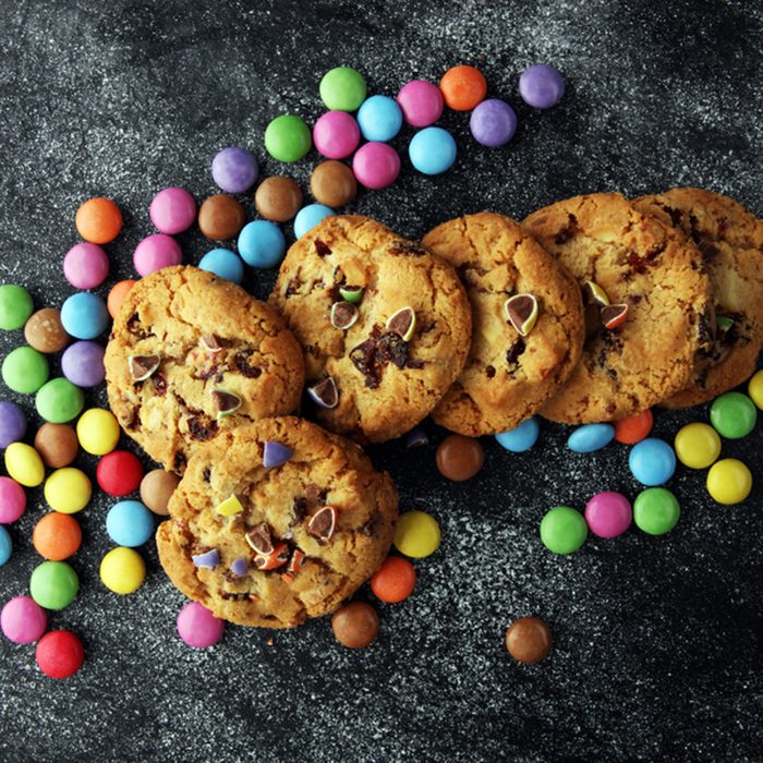 Chocolate cookies with colorful candies. 