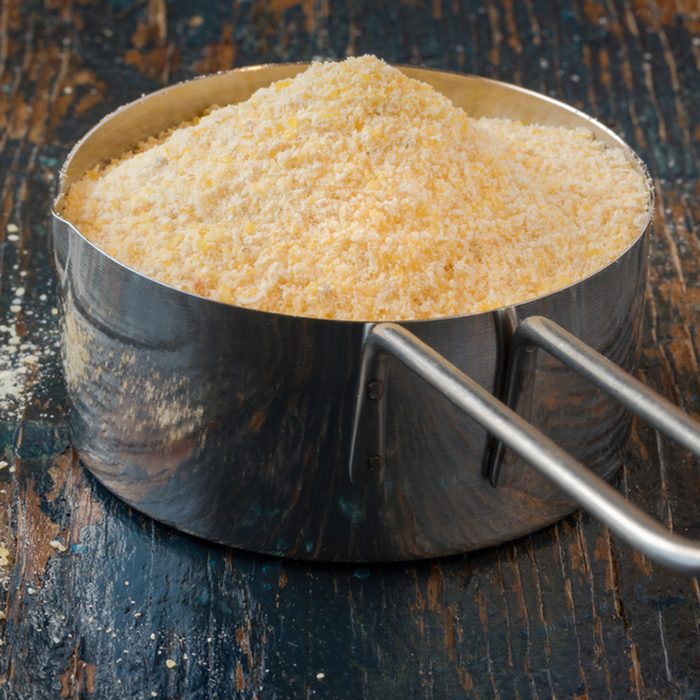 Corn meal in a measuring cup