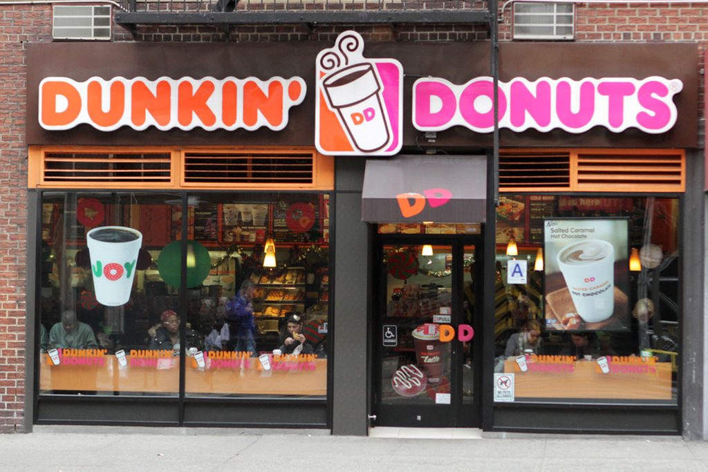 An exterior view of a Dunkin Donuts coffee shop in New York City
