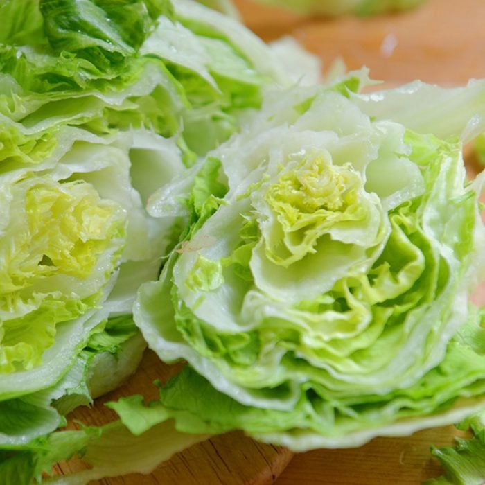 Fresh Green Iceberg lettuce prepared on table