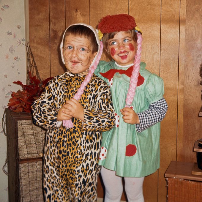 children dressed as a leopard and raggedy anne for Halloween 
