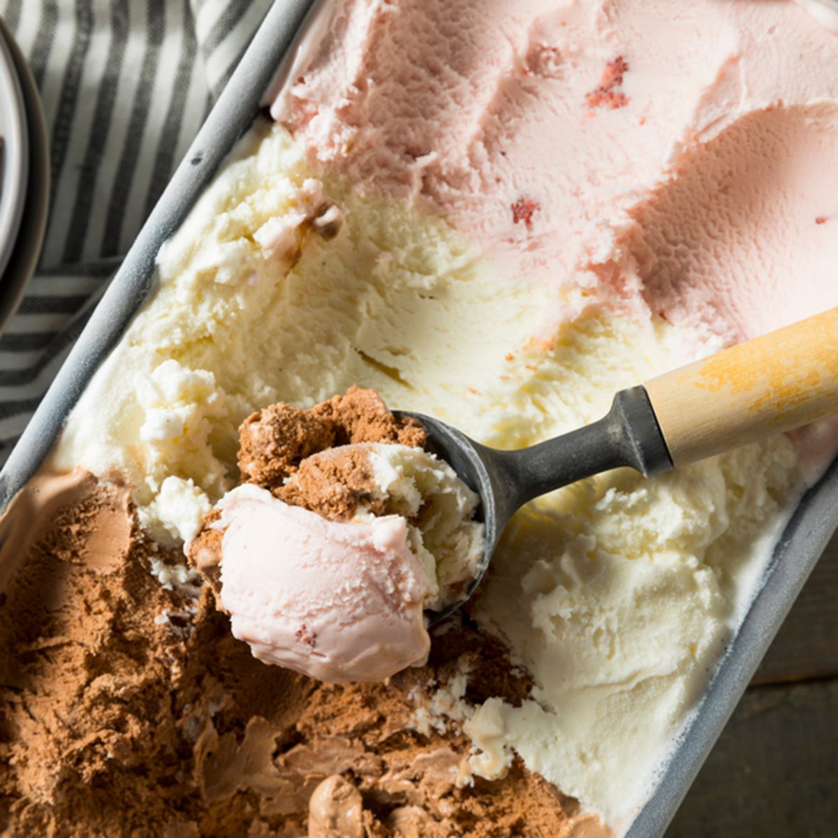 Homemade Neopolitan Ice Cream with Vanilla Chocolate and Strawberry; Shutterstock ID 1093782701
