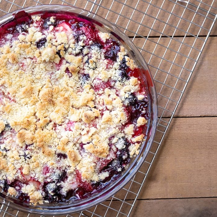 Top down close up on a freshly baked strawberry and blueberry fruit cobbler pie