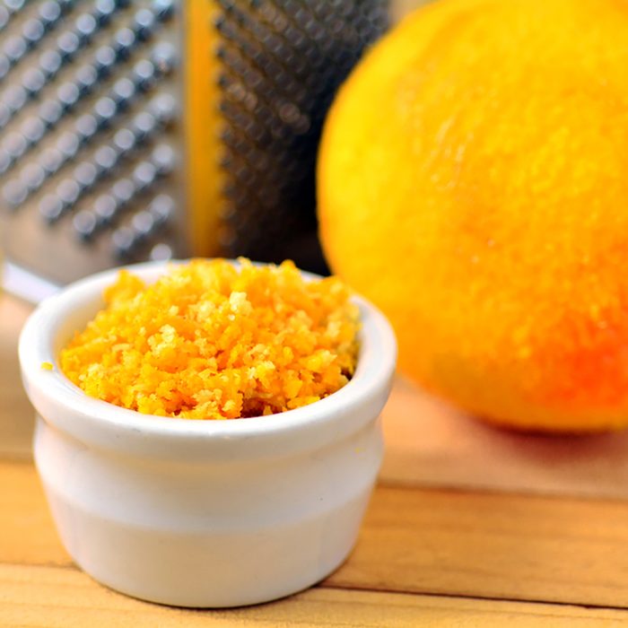 Grated citrus (orange and lemon) rind and grater.