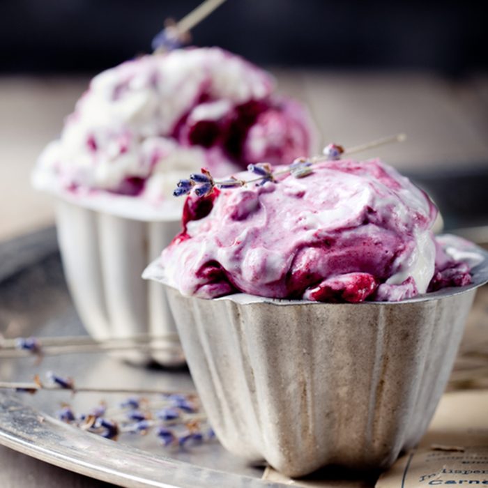Berry ice cream in vintage metal cups on a old metal tray with lavender flowers on a wooden background; Shutterstock ID 186315893; Job (TFH, TOH, RD, BNB, CWM, CM): Taste of Home
