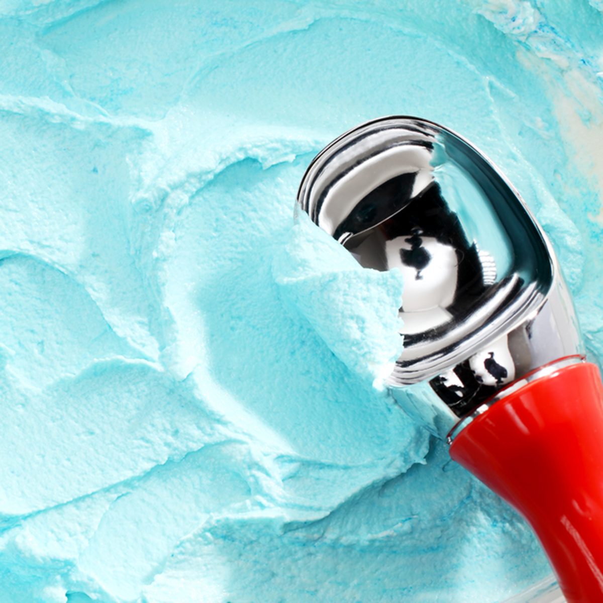 High Angle Close Up View of Red Handled Scoop Serving Blue Colored Ice Cream; Shutterstock ID 286485767; Job (TFH, TOH, RD, BNB, CWM, CM): Taste of Home
