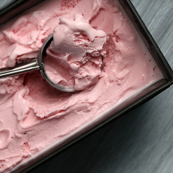 Homemade ice cream in frozen metallic container on wooden background; Shutterstock ID 342058604; Job (TFH, TOH, RD, BNB, CWM, CM): Taste of Home