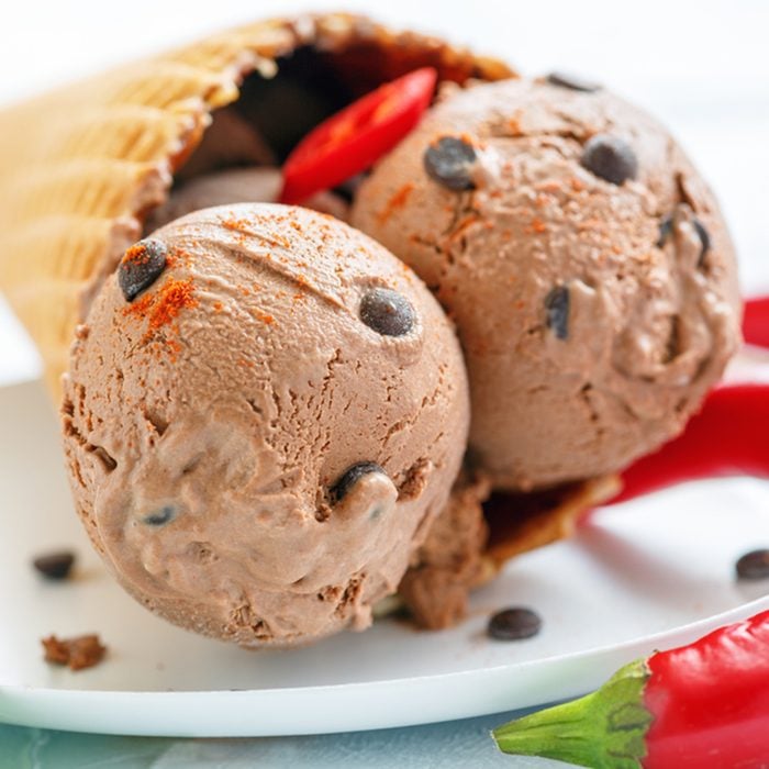 Homemade chocolate ice cream with chili pepper on a white plate, selective focus.; Shutterstock ID 662855248; Job (TFH, TOH, RD, BNB, CWM, CM): Taste of Home