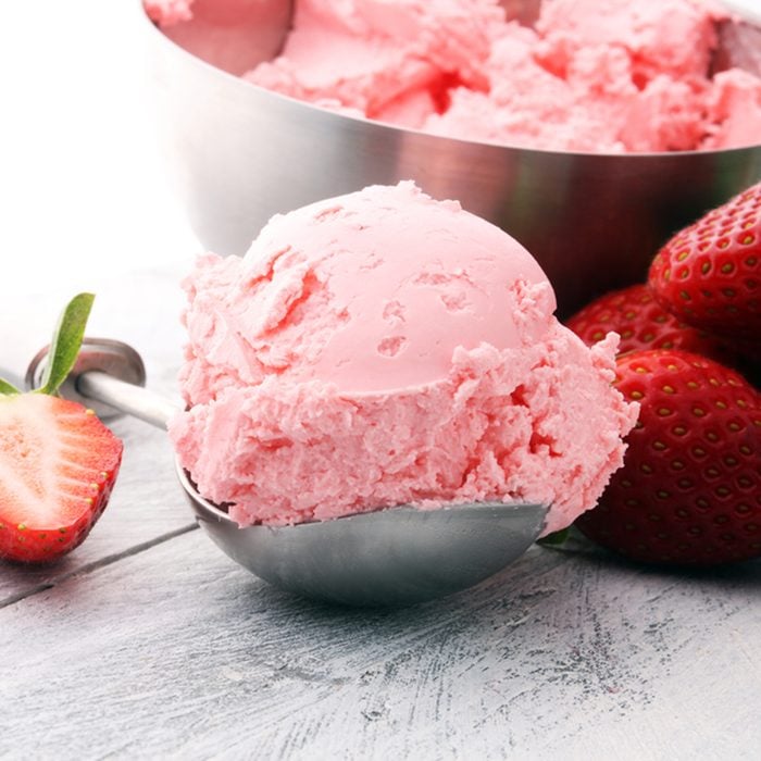 Delicious strawberry ice cream scoop with fresh strawberries on wooden background; Shutterstock ID 788131651; Job (TFH, TOH, RD, BNB, CWM, CM): Taste of Home