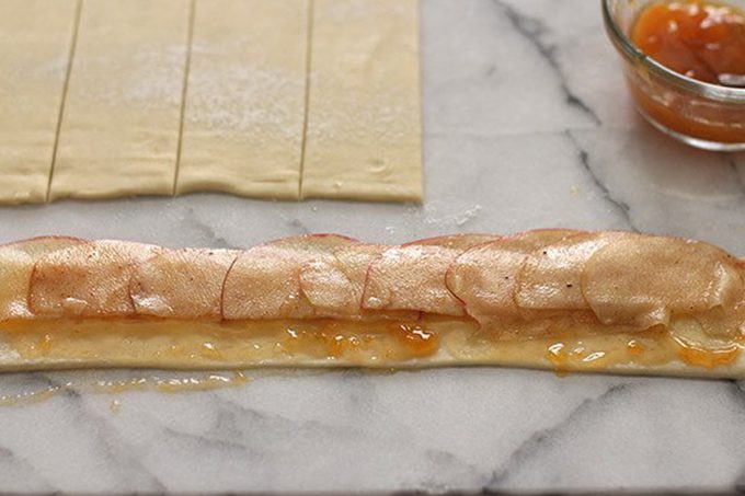Apple slices on dough