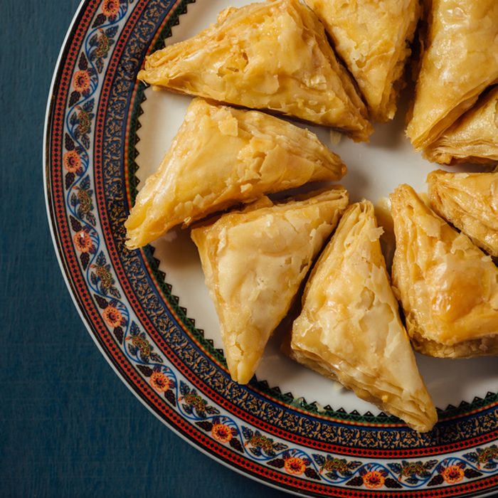 Baklava - an arabian sweet made with baked filo, stuffed with crushed nuts and basted with honey or sugar syrup.