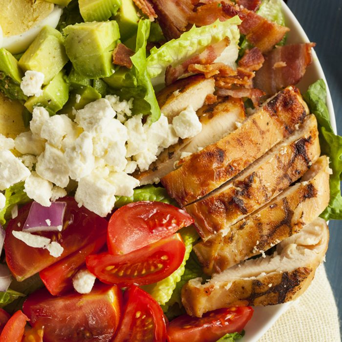 Hearty Cobb Salad with Chicken Bacon Tomato Onions and Eggs
