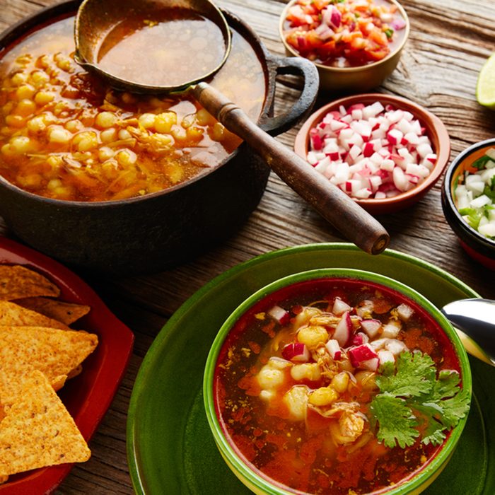 Pozole with mote big corn stew from Mexico with ingredients and appetizer