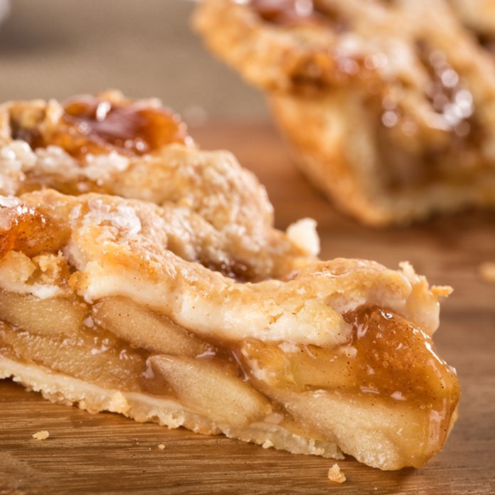 Slice of mouth watering rustic apple pie