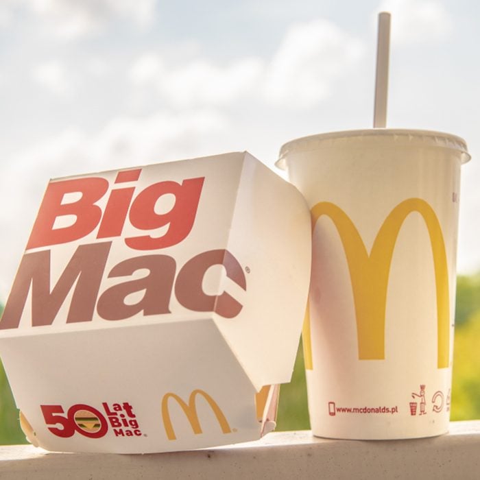 McDonald's Big Mac with two 100% pure beef patties and sauce sandwiched between sesame seed bun, with refreshing Coca-Cola Coke, big yellow McDonald's M sign, logo on cup