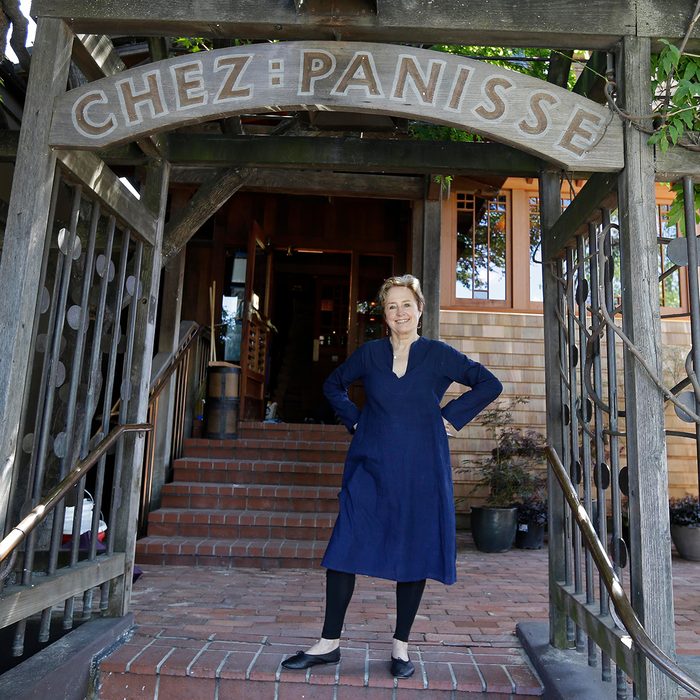 Alice Waters poses outside the new front entrance to Chez Panisse restaurant in Berkeley, Calif.