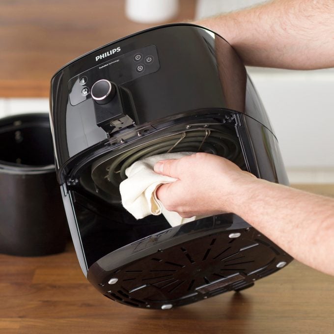 Cleaning Air Fryer heating Coil with damp cloth