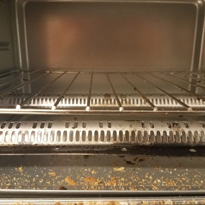 inside a toaster oven with bread crumbs