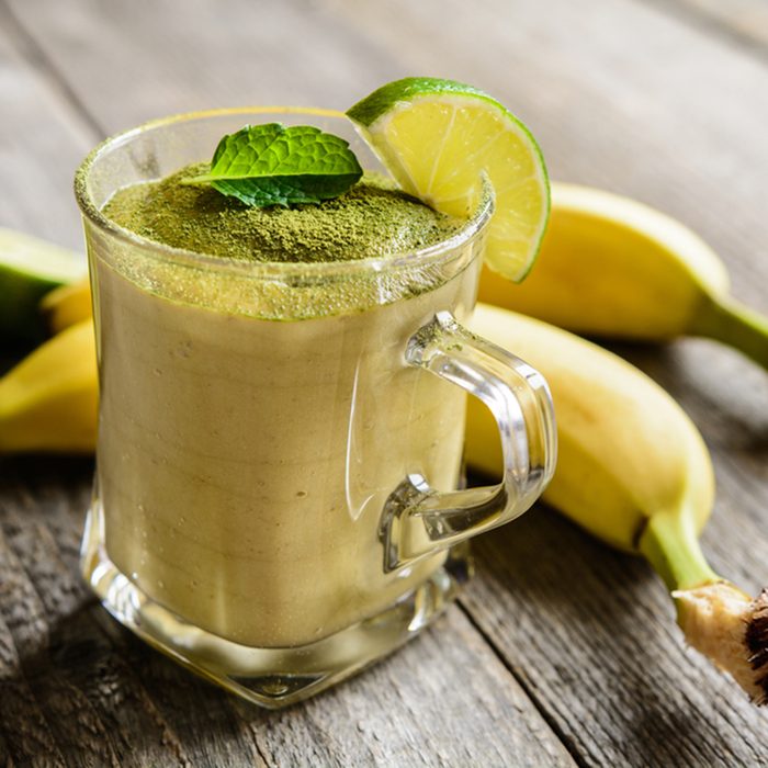 Healthy smoothie with banana and Matcha tea in a glass jar