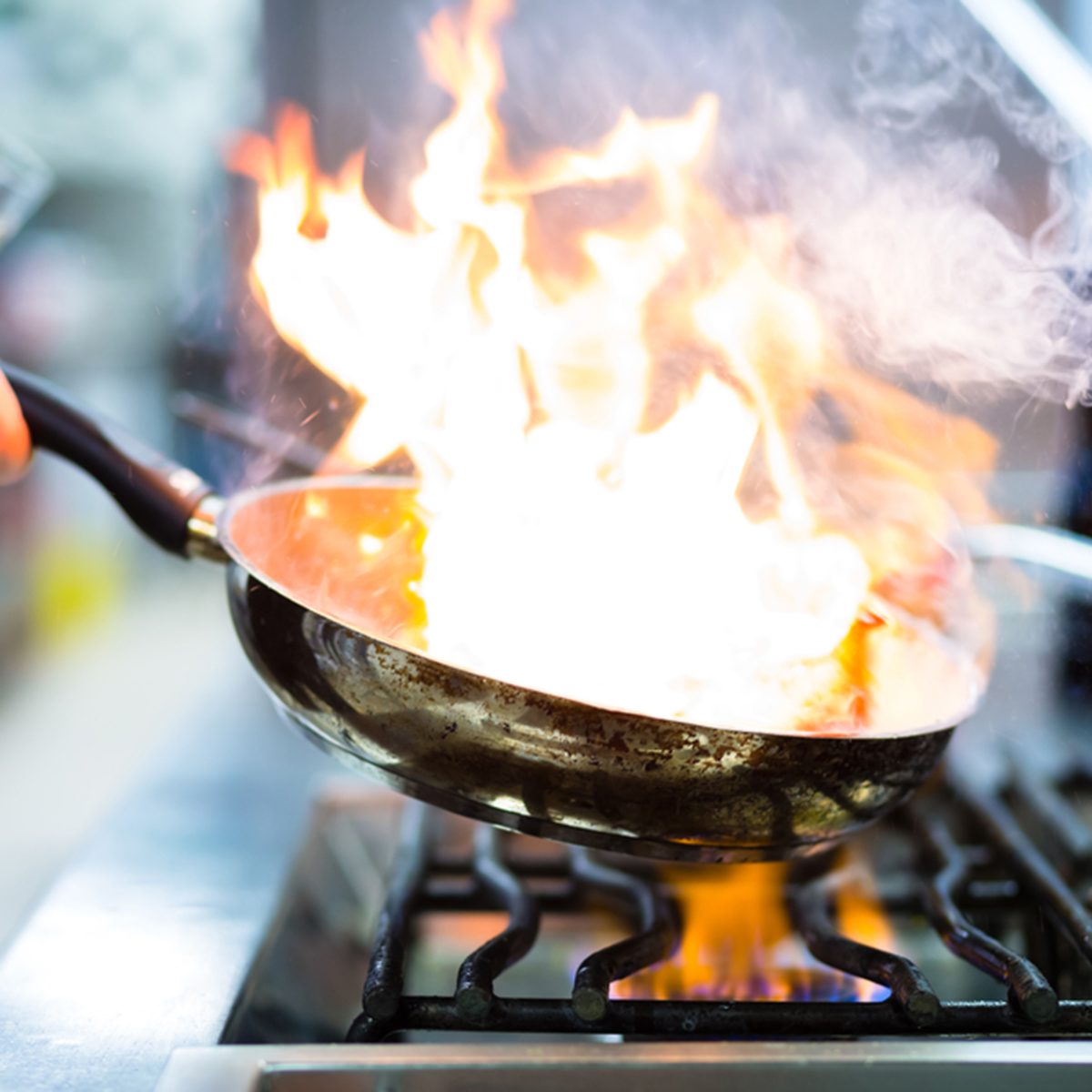 The Real Reason Restaurant Pans Sometimes Catch On Fire