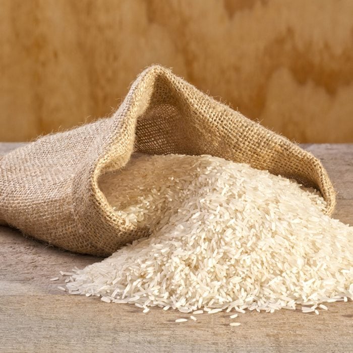 Basmati Rice Spilling from Sack - basmati rice spilling from burlap or jute sack.