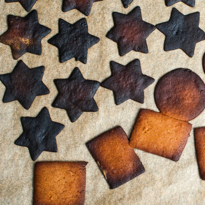 Baking tray with burnt gingerbread cookies; Shutterstock ID 238370437