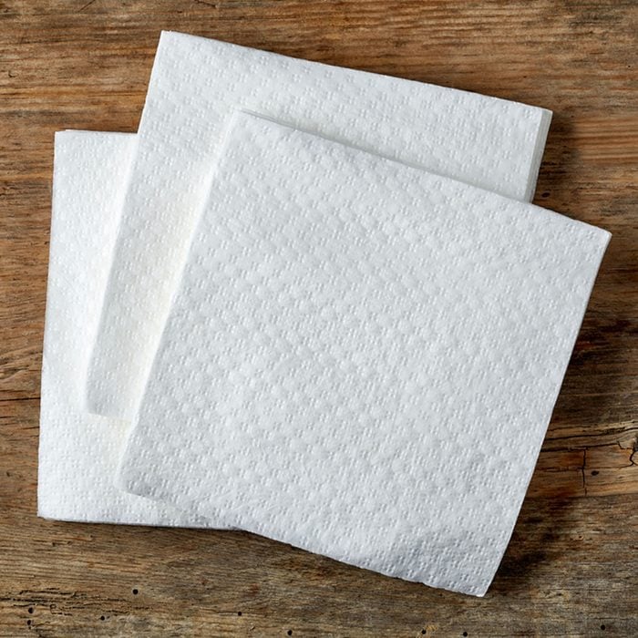 White paper napkin on wooden table, top view; Shutterstock ID 374417176; Job (TFH, TOH, RD, BNB, CWM, CM): Taste of Home