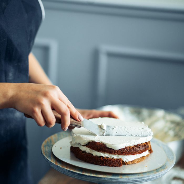 Woman Carefully Icing The Cake And Decorating; Shutterstock ID 649601008
