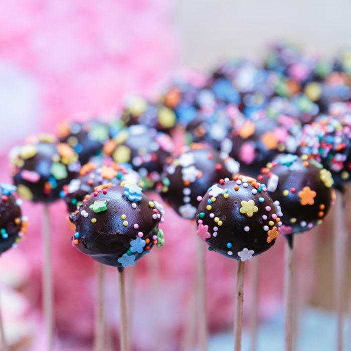 Chocolate cake pops on pink background party; Shutterstock ID 715905061; Job (TFH, TOH, RD, BNB, CWM, CM): Taste of Home