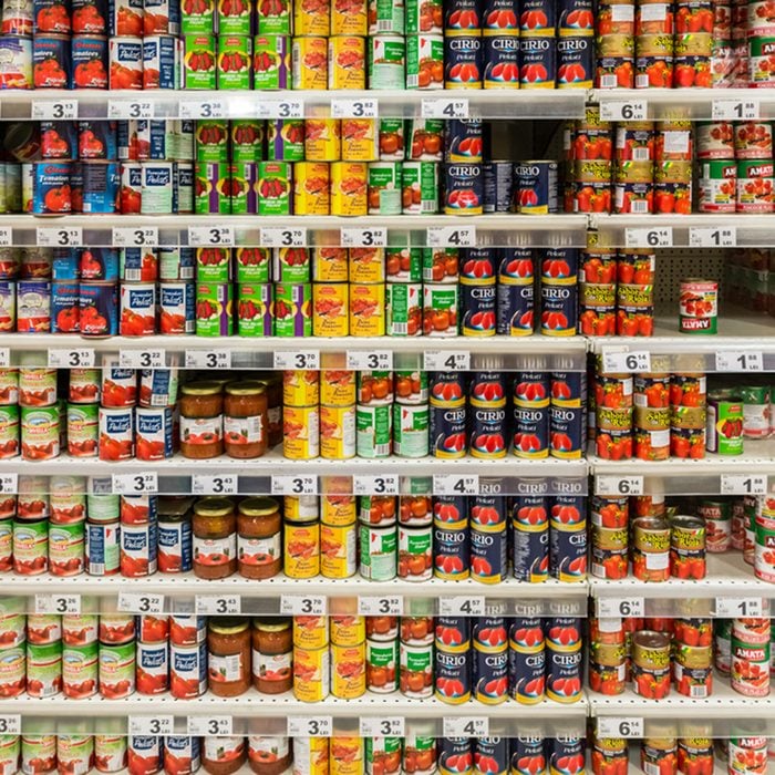 Canned Food On Supermarket Stand.