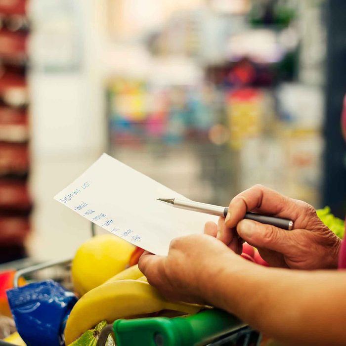 Woman looking over her shopping list