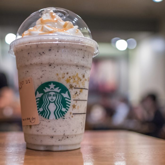 Starbucks blended milk and ice topped with whipped cream and caramel frappuccino.