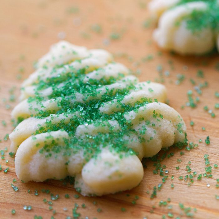 Christmas Tree Spritz Cookies with green sugar sprinkles