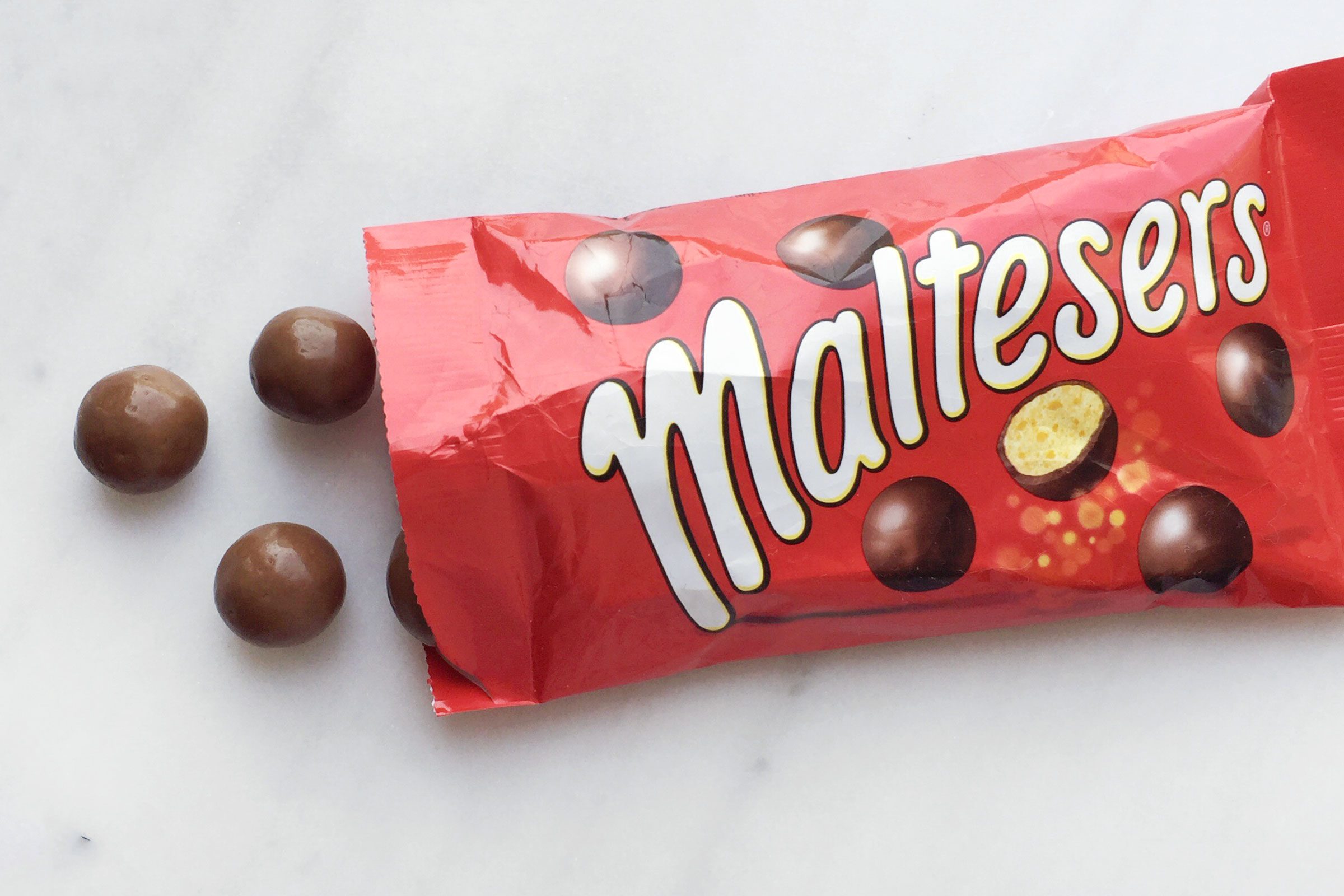 Maltesers chocolates on a marble surface
