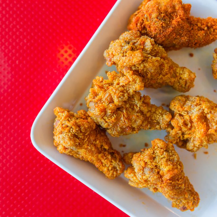 kentucky style fried chicken on red background